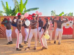 African dance performance team filming a live blessing video